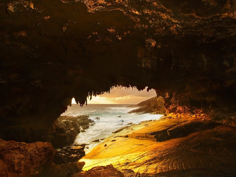 Low sun through the cave roof of Admirals Arch