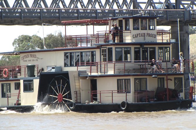 The Captain Proud paddle boat under way, its paddle wheel turning