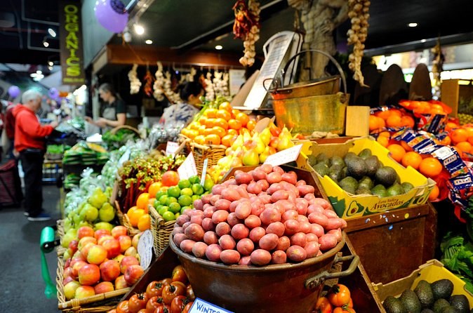 Fruit and vegetables piled high on a market stall