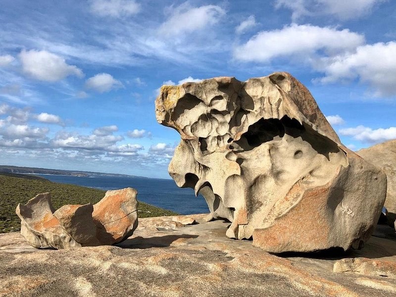The wind-carved granite of the Remarkable Rocks above the sea